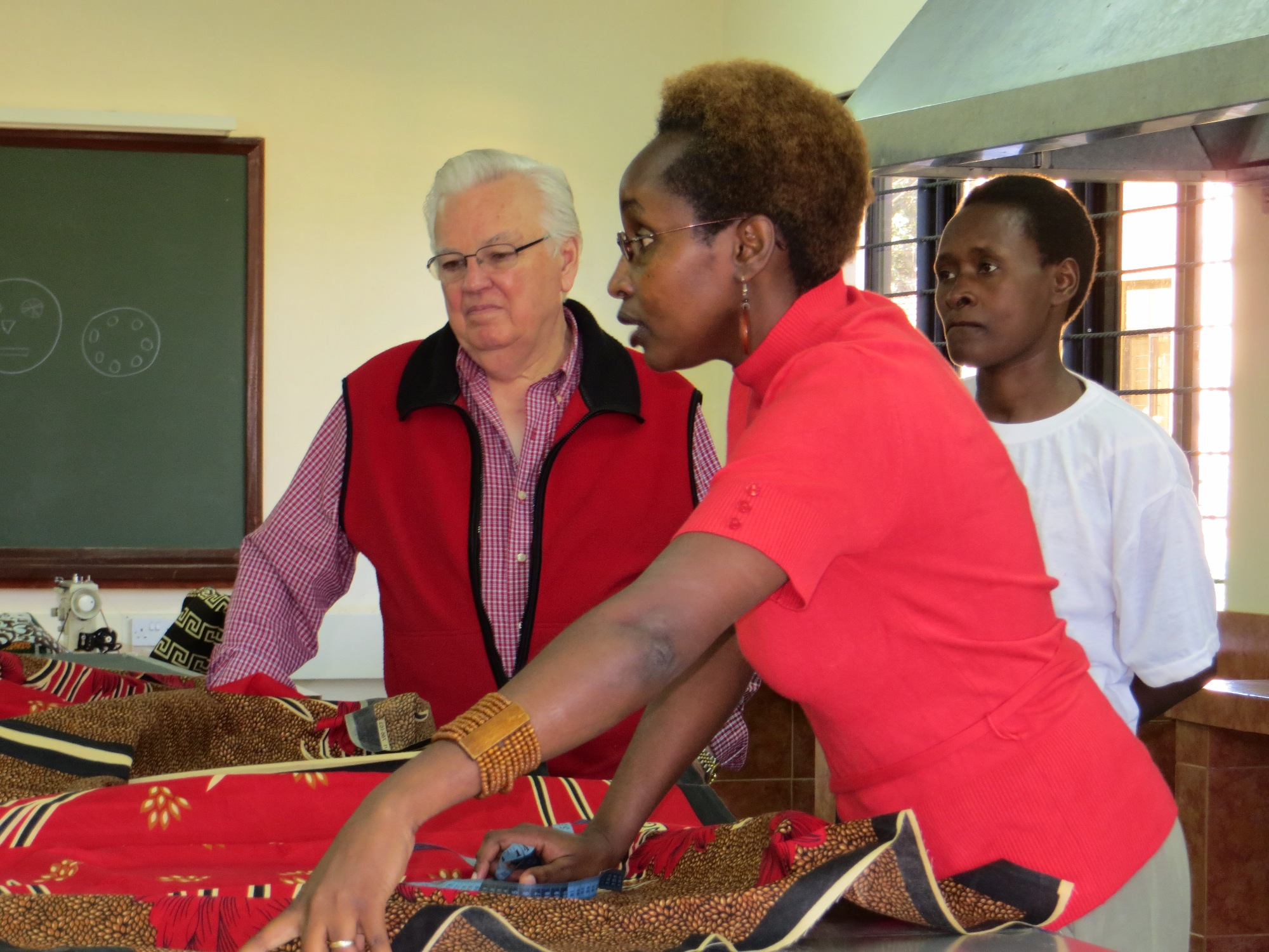 Mary Ogalo giving instructions in sewing room in Kenya.